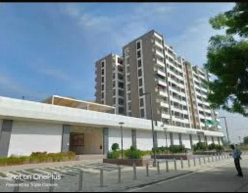 A residential tower above a commercial podium at Scheme No. 136, Niranjanpur